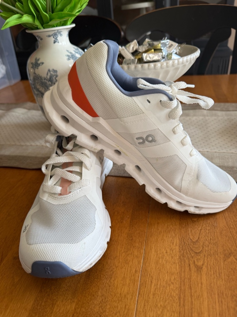 On Running Women's White Athletic Shoes with Orange Accent